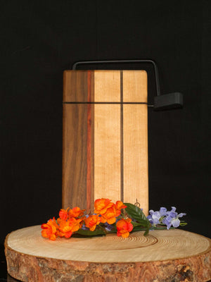 Figure 8 Woodworking Chestermere Cheese Slicer with black hardware made of padauk, walnut and maple wood
