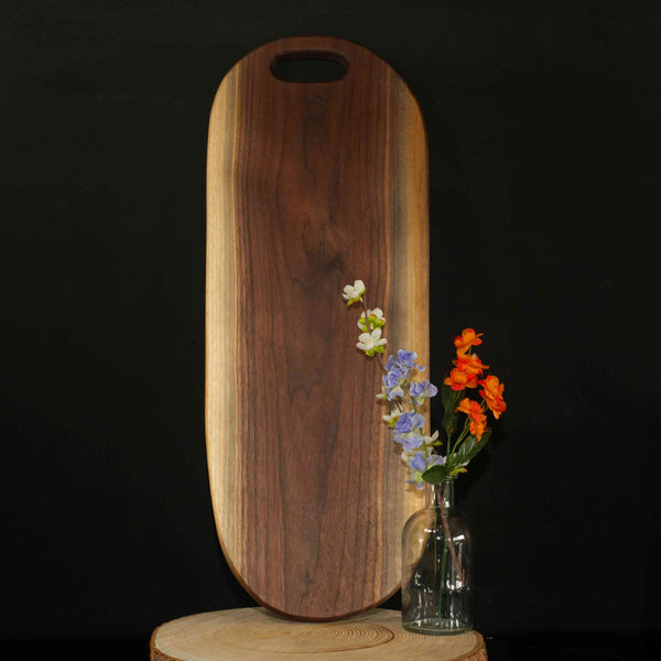 Figure 8 Woodworking Kananaskis charcuterie board made with live-edge walnut wood