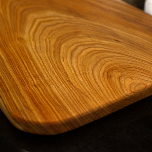 Figure 8 Woodworking Kicking Horse charcuterie board made with live-edge canary wood