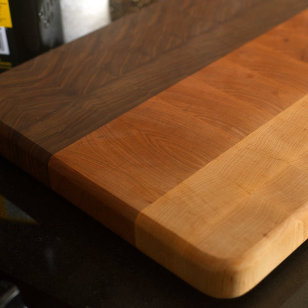 Figure 8 Woodworking Ya Ha cutting board or butcher block made with end-grain maple, cherry and walnut wood with a striped pattern